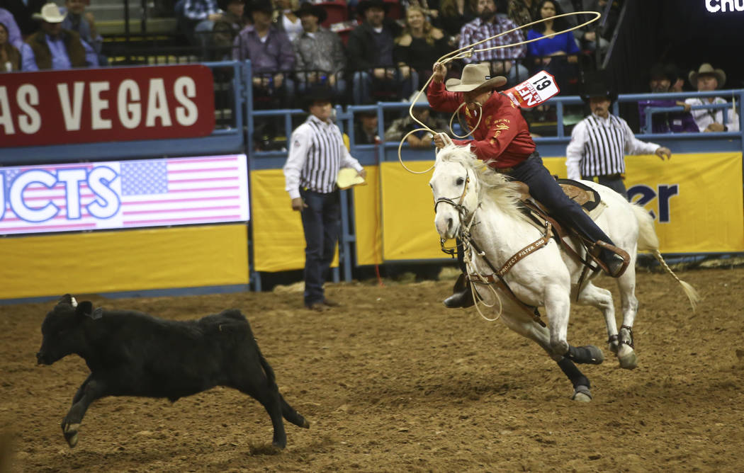 Matt Shiozawa competes in the tie-down roping event during the second night of the National Finals Rodeo at the Thomas & Mack Center in Las Vegas on Friday, Dec. 8, 2017. Chase Stevens Las Veg ...