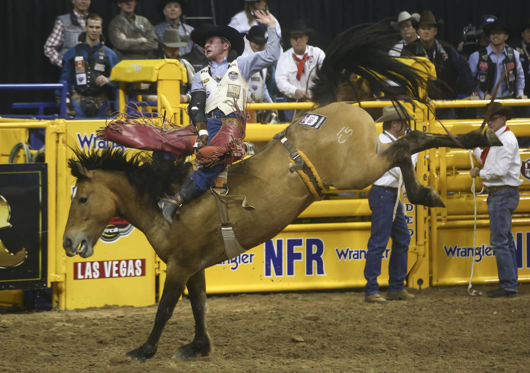 Bill Tutor competes in the bareback riding event during the second night of the National Finals Rodeo at the Thomas & Mack Center in Las Vegas on Friday, Dec. 8, 2017. Chase Stevens Las Vegas ...